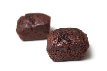 closeup of mini brownies on white background