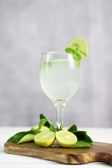 Lime juice, limes slice with mint leaves on table, Fresh drink lemonade.
