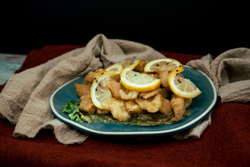 Chinese food fried fish and lemon slices