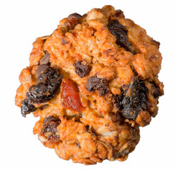Homemade cookies made from oats, flour and eggs with chocolate, dried apricots, prunes, raisins and olive oil, on a white background