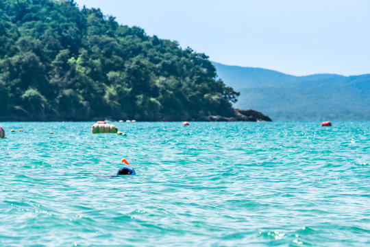Boy does snorkeling on islands.