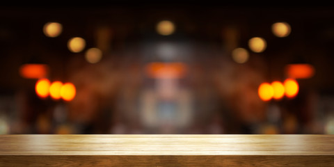 Empty wooden table top with blur coffee shop or restaurant interior background, Panoramic banner.