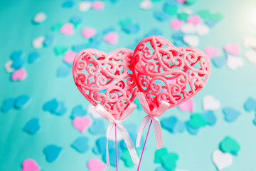 Valentine's Day. Symbol of love. Two pink heart on blue background, selective focus