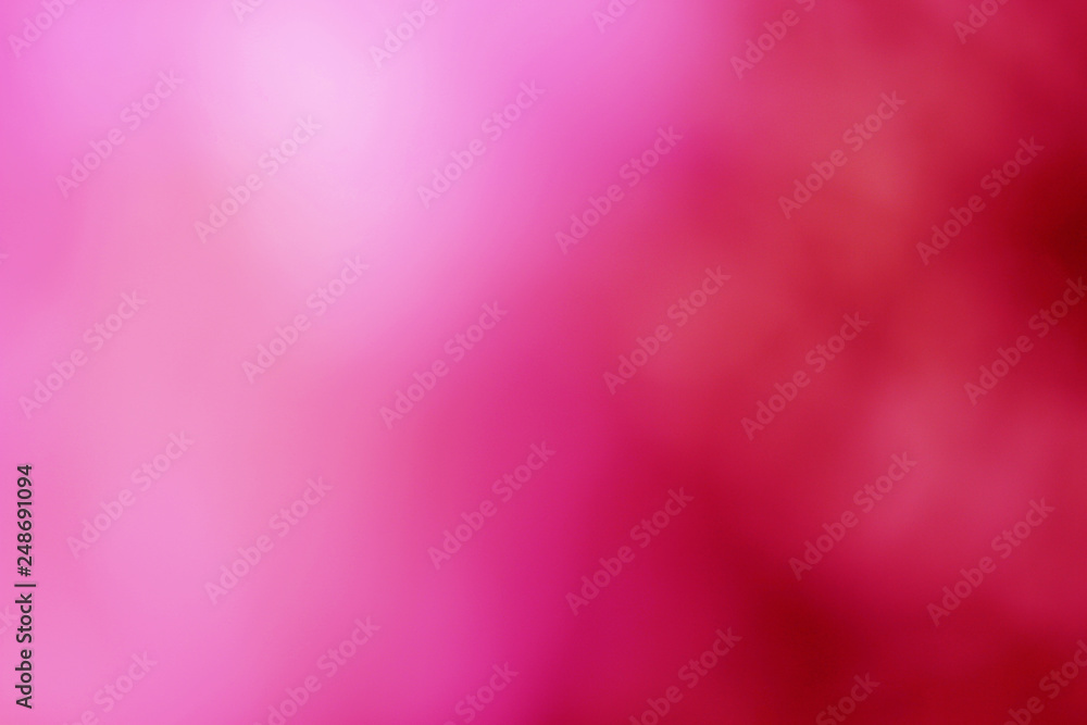 Wall mural abstract blurred pink and red color background.