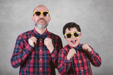 Father's day, father and son with tie and sunglasses