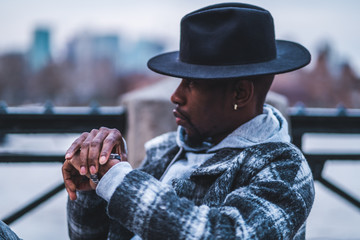 Young fashionable man posing for stylish urban photo shoot 