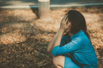 Beautiful thai woman very sad from unrequited love,rethink,think over,vintage style,dark tone,broken heart,asian girl