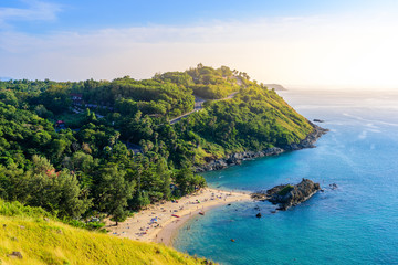 Fototapeta premium Sunset over Promthep Cape and Yanui beach. Tropical coast with paradise beaches on Phuket, Thailand.