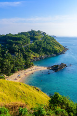 Sunset over Promthep Cape and Yanui beach. Tropical coast with paradise beaches on Phuket, Thailand.