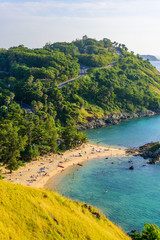 Sunset over Promthep Cape and Yanui beach. Tropical coast with paradise beaches on Phuket, Thailand.