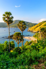 Fototapeta na wymiar Yanui Beach is a paradise cove located between Nai Harn Beach and Promthep Cape in Phuket, Thailand. On a sunny summer day at sunset.
