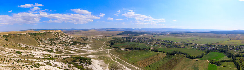top view from White rock or Aq Qaya on a Sunny summer day. Crimea. White limestone with a vertical cliff