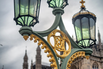 Fototapeta na wymiar Street lamp with city landmark in background, London