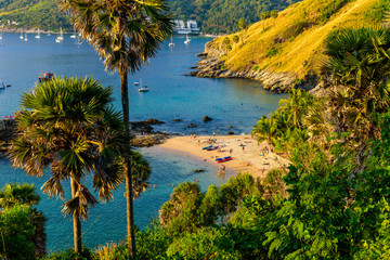 Yanui Beach is a paradise cove located between Nai Harn Beach and Promthep Cape in Phuket, Thailand. On a sunny summer day at sunset.
