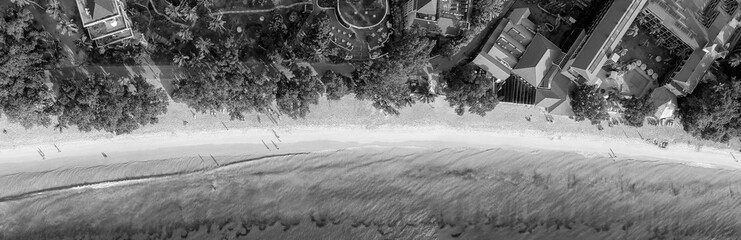 Beautiful aerial overhead view of ocean beach with crystal clear water