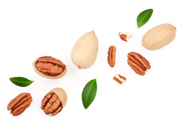 pecan nut decorated with green leaves isolated on white background. Top view. Flat lay