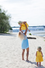 Mother and daughters on beautiful summer day
