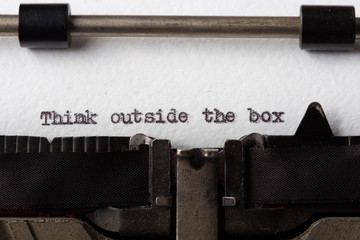Think Outside The Box text on the typewriter