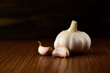 Garlic bulb on the wooden vintage background