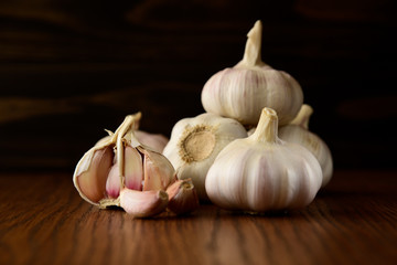 Garlic bulb on the wooden vintage background
