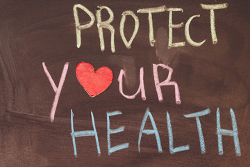 Handwriting  text : protect  your health with colorful chalk