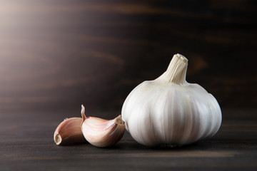 Garlic bulb on the wooden vintage background