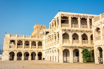 Historic building housing stables with Arabian horses in Doha, Qatar.