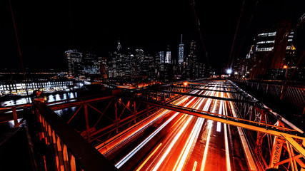 Brooklyn Bridge Traffic lights lines trails at night New York, USA, long exposure time, Slow...