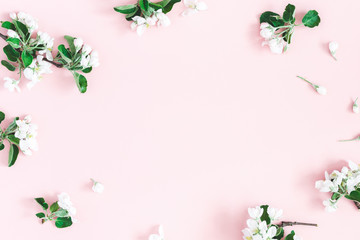 Flowers composition. Apple tree flowers on pastel pink background. Spring concept. Flat lay, top view, copy space