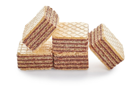 Pile of wafer biscuits cubes isolated on white background.