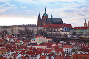 View on the red roofs of Mala Strana and St. Vitus Cathedral in Prague.