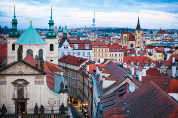 View on the roofs and street in Stare Misto. Prague. Sunset