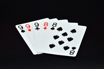 Obraz premium jugada de poker, full de ochos y nueves