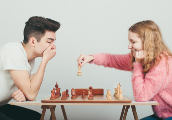 Checkmate. Boy is surprised by last move his opponent in chess game