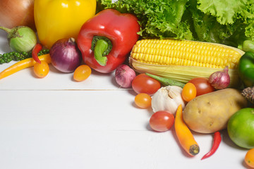 Raw organic vegetables on white wooden background, Healthy food.