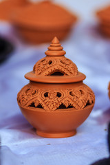 Fototapeta na wymiar Beautiful handmade ceramic lamp in Thai's style patterns. Pottery Lamp with Thai style