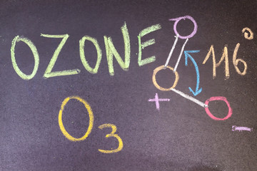 name, chemical formula and structure diagram of Ozone handwritten on blackboard with colorful chalk