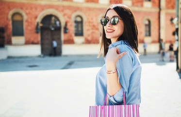 Modern young woman enjoying in shopping. Consumerism,  lifestyle concept