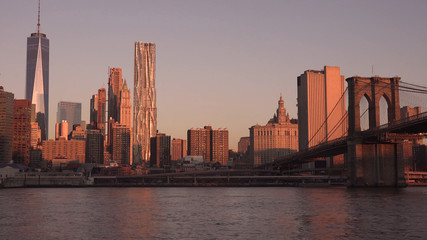 Fototapeta na wymiar New York sunrise on Brooklyn Bridge and Manhattan