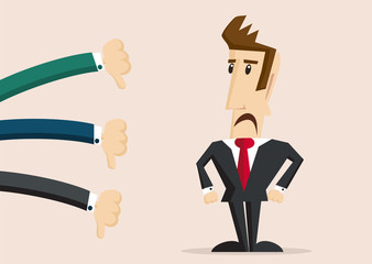 businessman with many thumbs down hands around him.