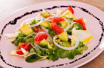 Deliciously salad of avocado, grapefruit, tomatoes and corn salad