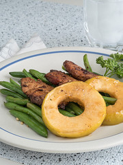 Meat Medallions Over Beans with Green Apple