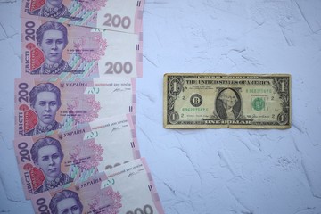 Banknote in one dollar and Ukrainian 200 hryvnia