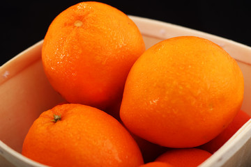 three lemons in a basket