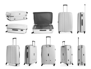 Set of stylish light suitcase for travelling on white background