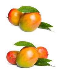 Set of whole ripe mangoes with leaves on white background