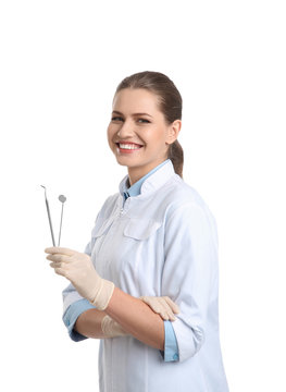 Female Dentist Holding Professional Tools On White Background