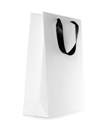 Paper shopping bag isolated on white. Mock up for design