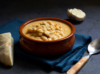 White bean stew, pasulj, bread, traditional balkan cuisine, dark background