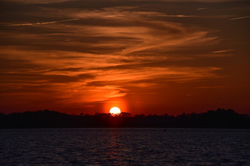 Orange ball of sun at sunset